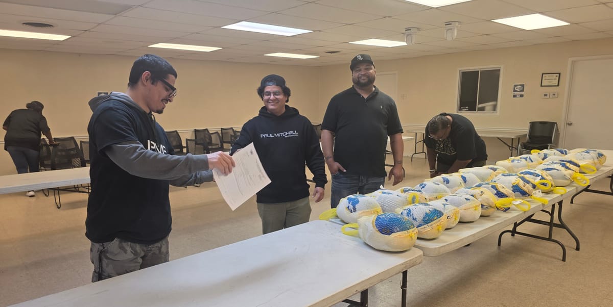 Wilmer residents take advantage of turkey and ham distribution for Thanksgiving
