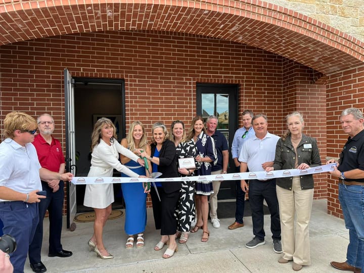 Photo of a ribbon cutting.