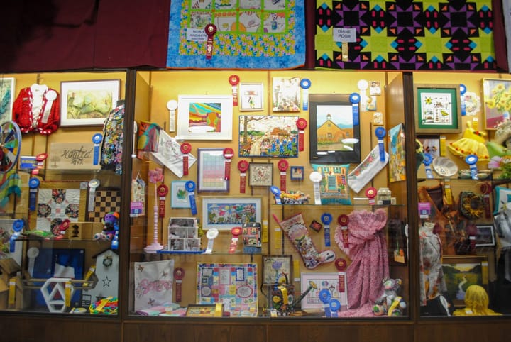 A photo of ribbons and related Creative Arts entries at the State Fair of Texas.