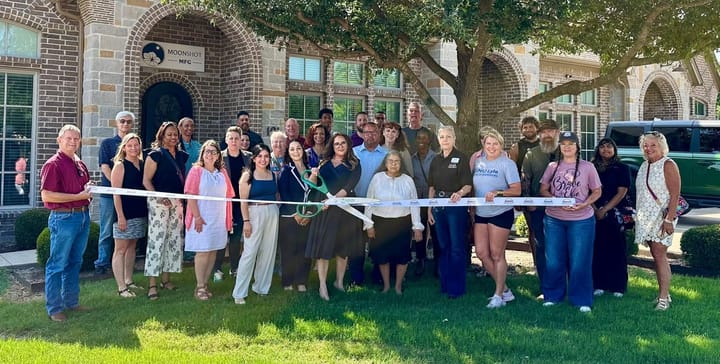 Photo of a ribbon cutting.