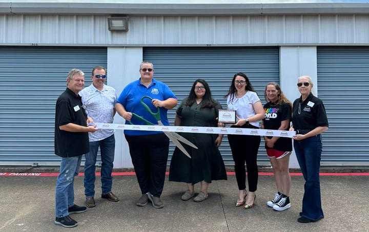 Photo of a ribbon cutting.