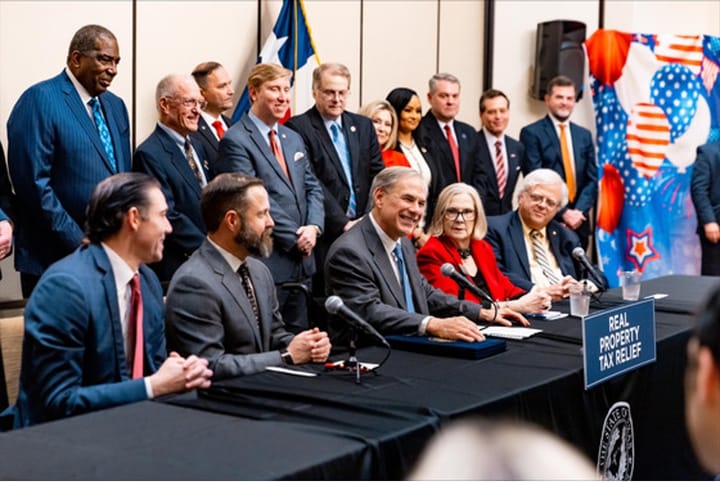 Photo of a bill signing ceremony.