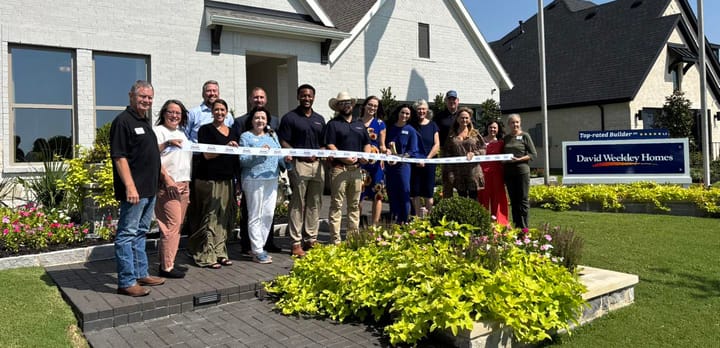 A ribbon cutting photo.