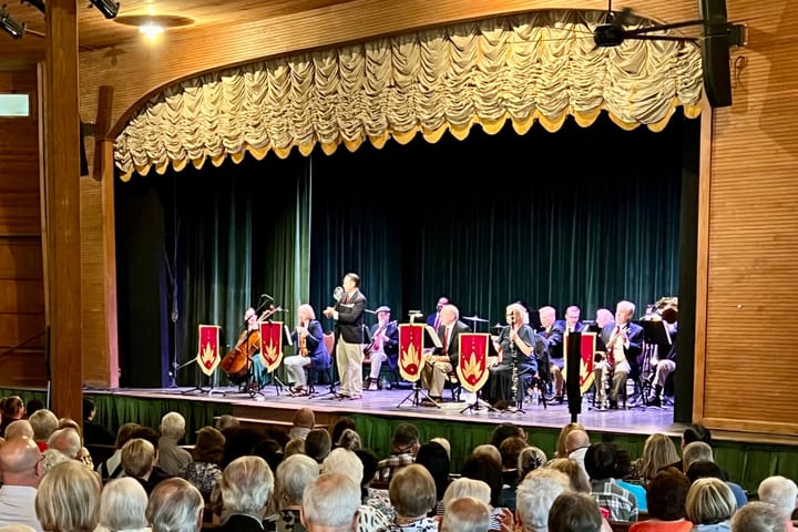 Photo of a musical group in concert.